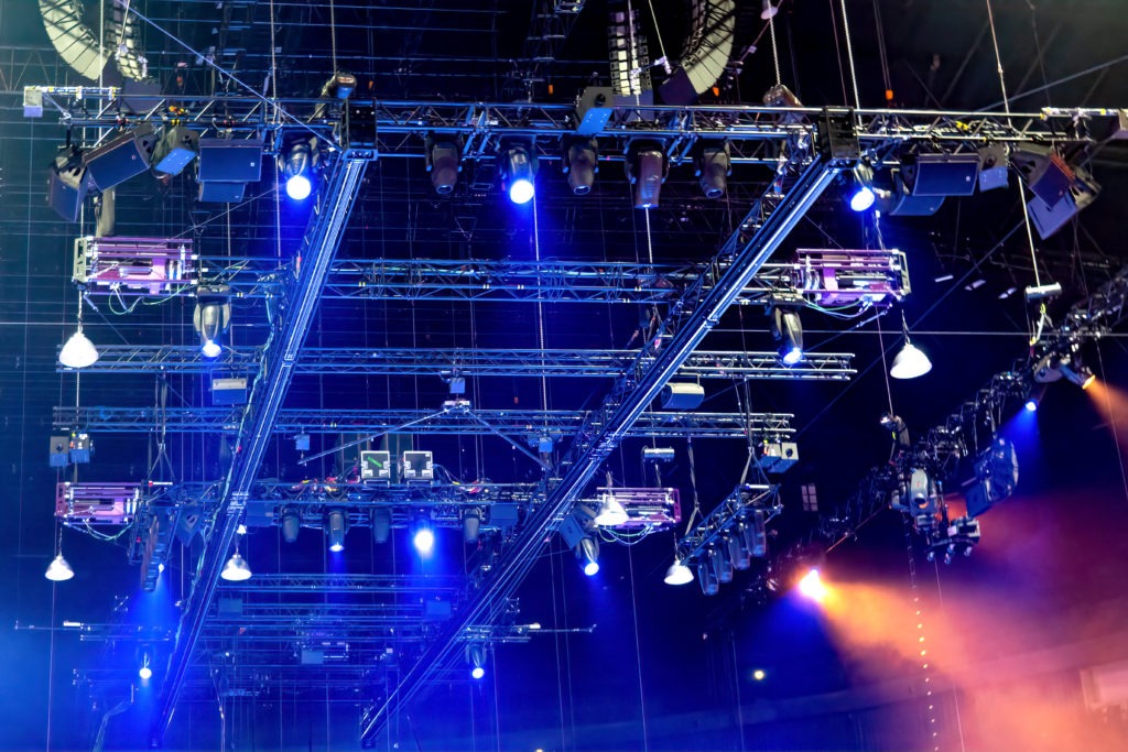 Lighting hanging from rigging at an event. 